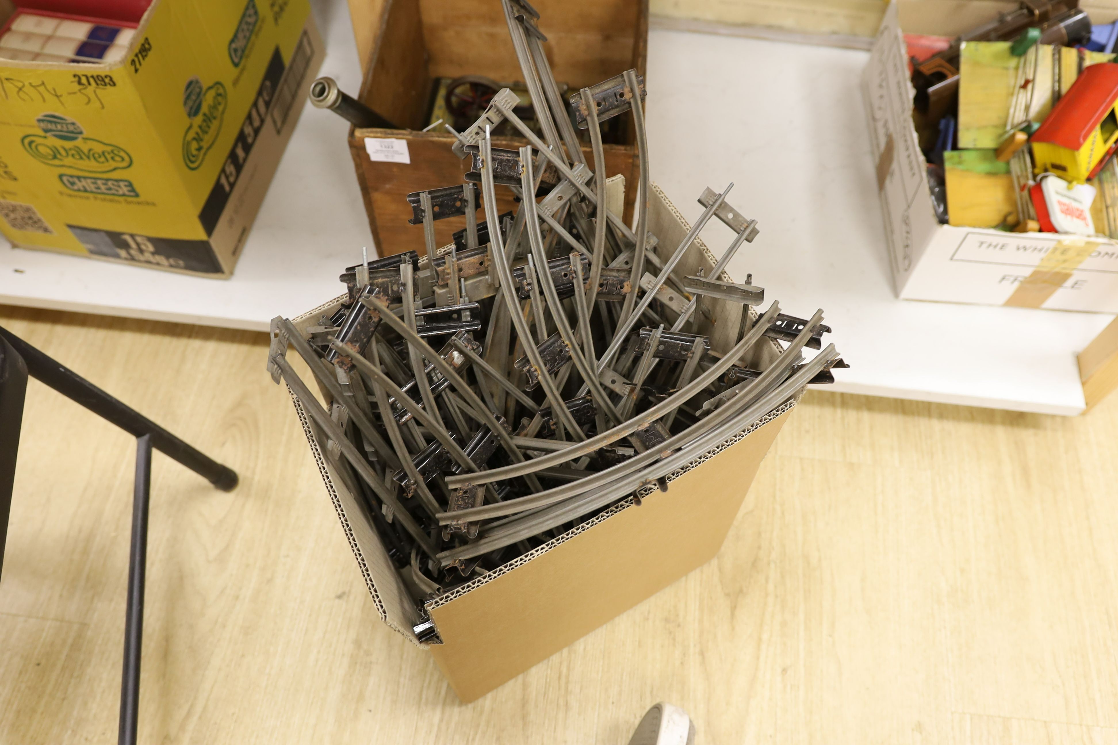 A mixed quantity of Hornby model railway track, a metal crossing, an engine and other items